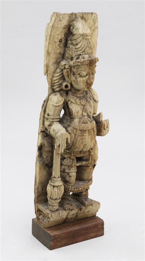 An Indian hardwood relief of a Hindu god, probably 19th century, 87cm, heavily weathered